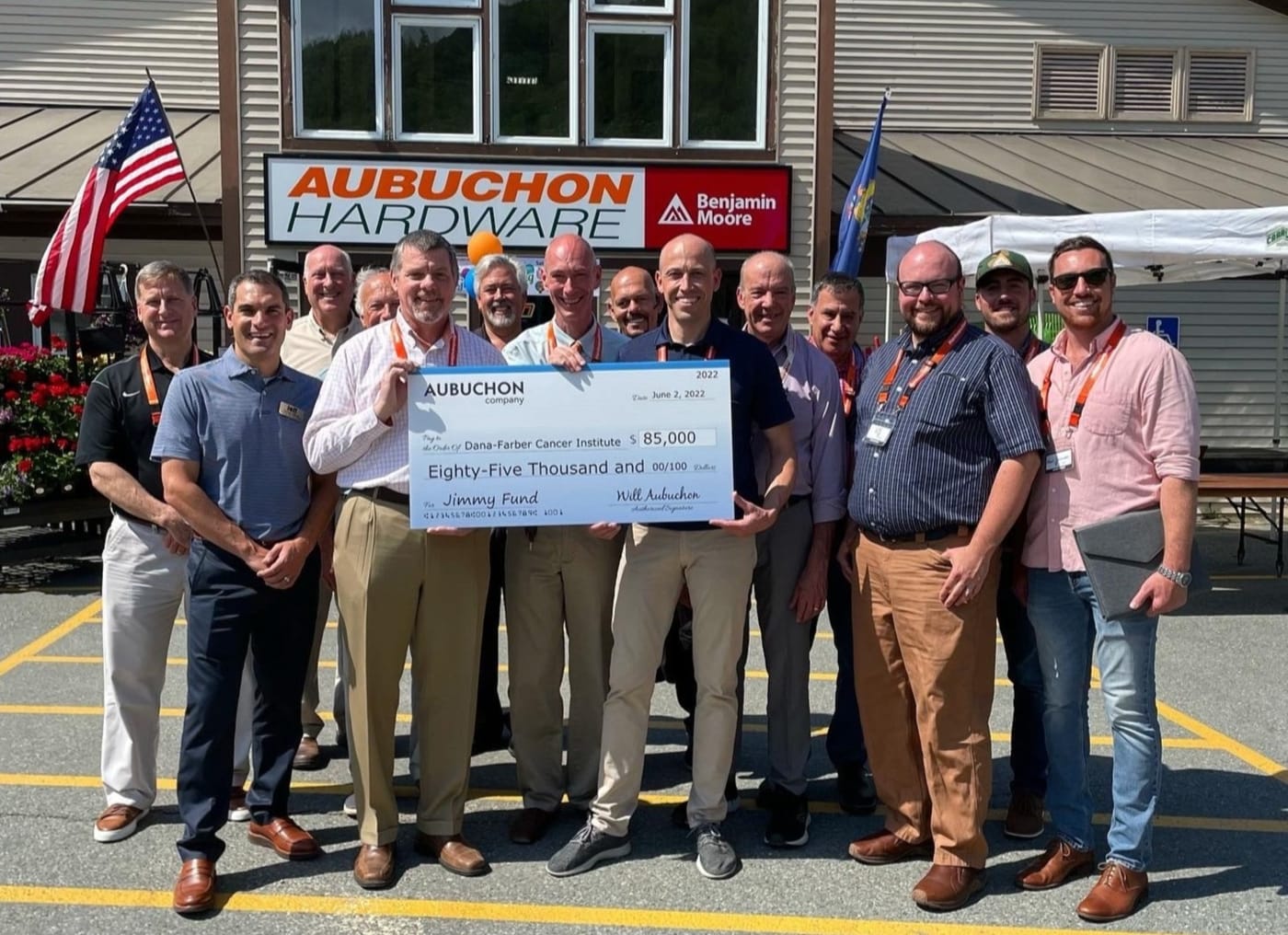 Aubuchon Company employees proudly present the $85,000 check